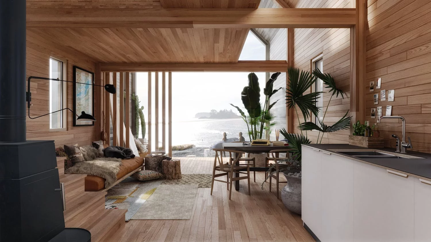 Interior of the The Surf Shack from Backcountry Hut Company, a prefab home with an open interior layout and generous glazing