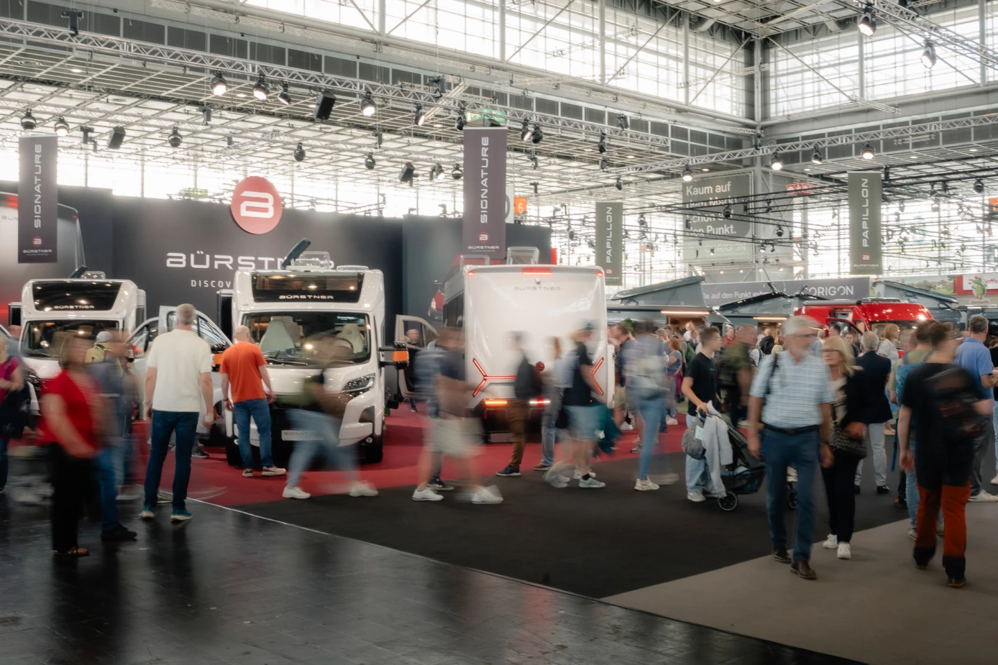 The Bürstner Signature peeks out from behind the bustling crowds of the 2025 Caravan Salon
