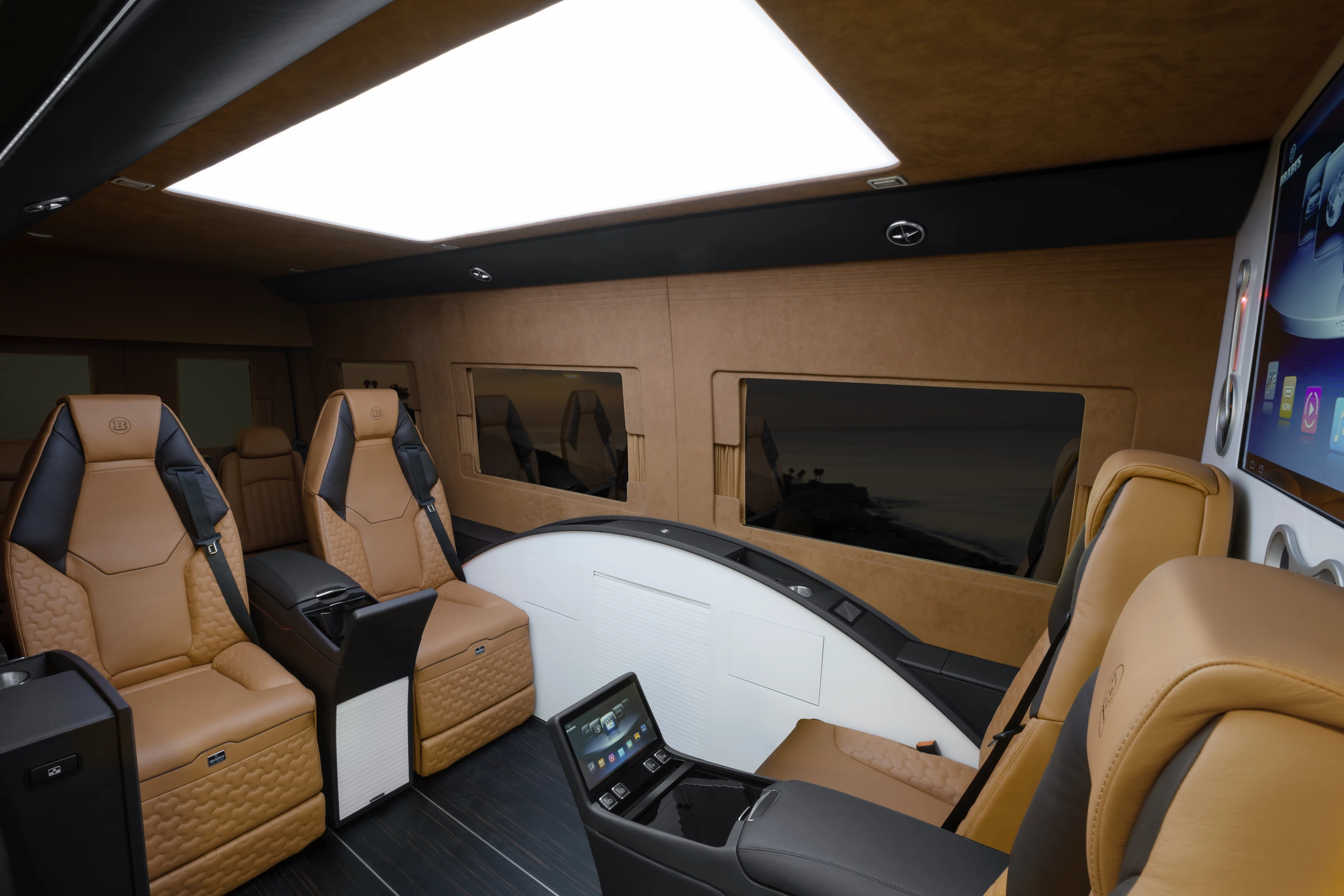The interior includes conference-style seating and a multimedia center