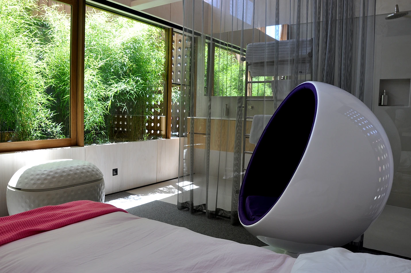 The bedroom includes an en-suite subtly separated by a metallic curtain (Photo: Edoardo Campanale for Gizmag)
