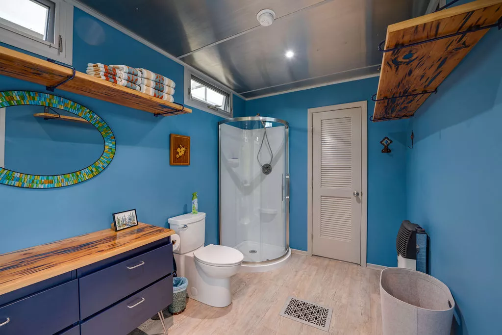The River Forest Lookout features a relatively large bathroom with a flushing toilet and a shower