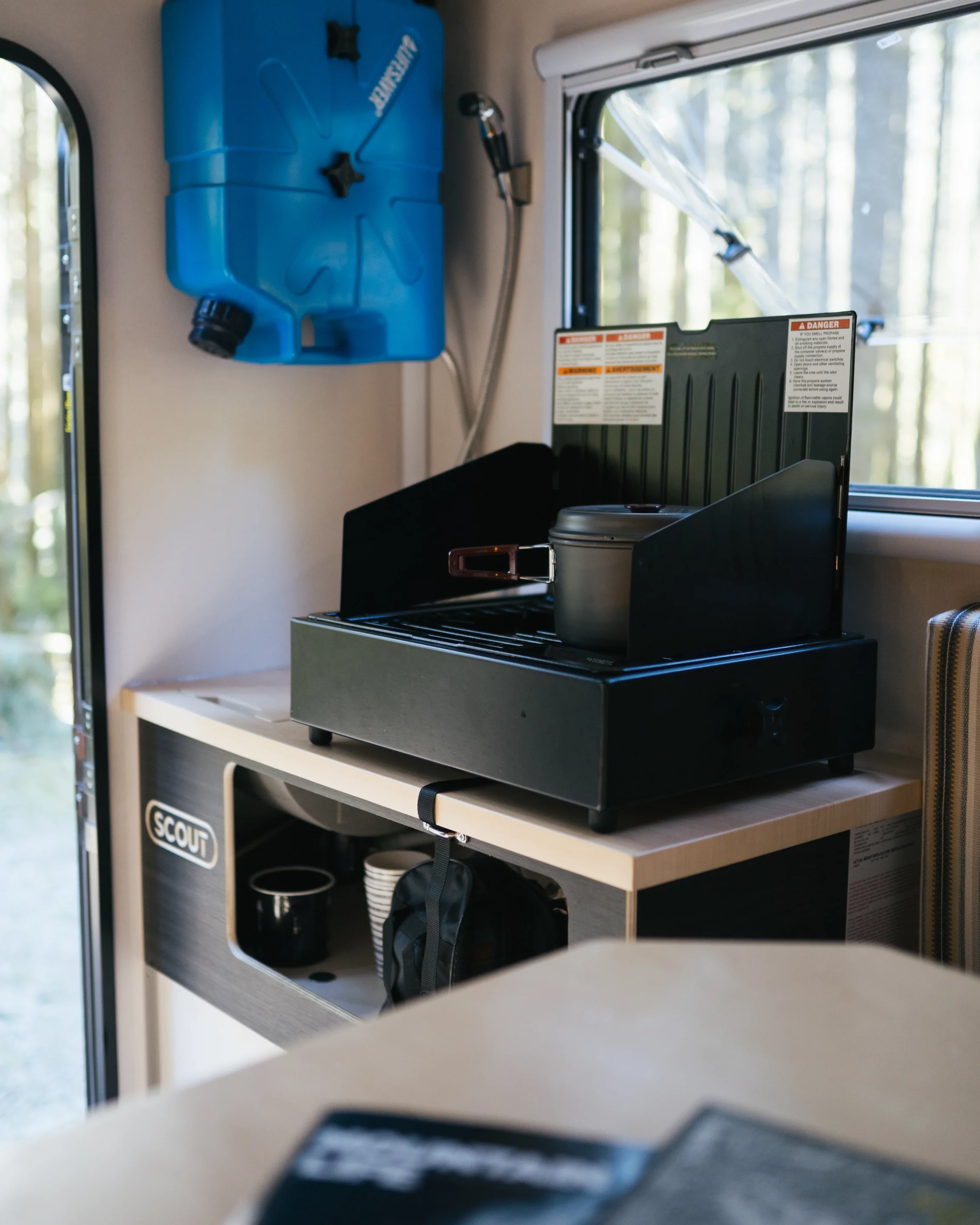 Flip the lid on the stove and use it indoors or out