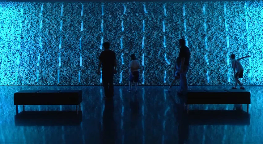 Children experiment with the Swarm Wall, an interactive art exhibit at the CU Art Museum