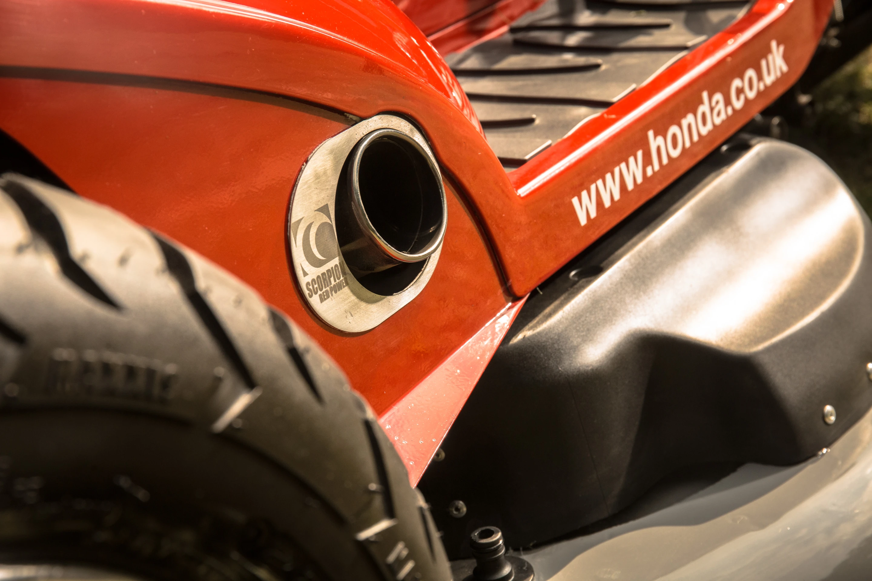 F1 style paddle shifters control the six speed gearbox driving the rear axle while a Scorpion exhaust system notifies the neighbors