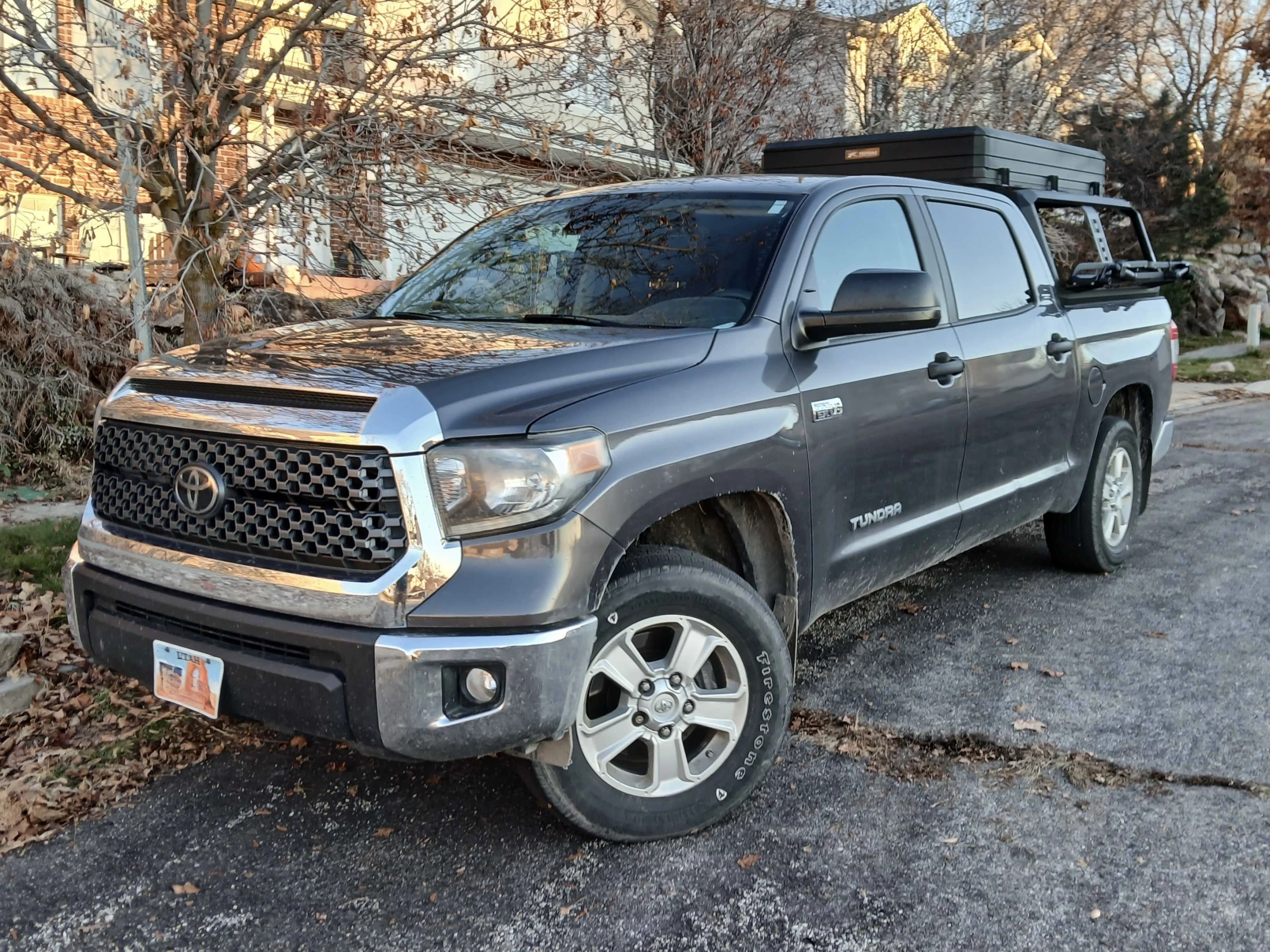The Kuat Ibex rack can be set to mid or full height, the full height being roughly cab height. Here's what the Topoak Vision XL looks like mounted on top; surprisingly, it hasn't affected fuel economy very much at all
