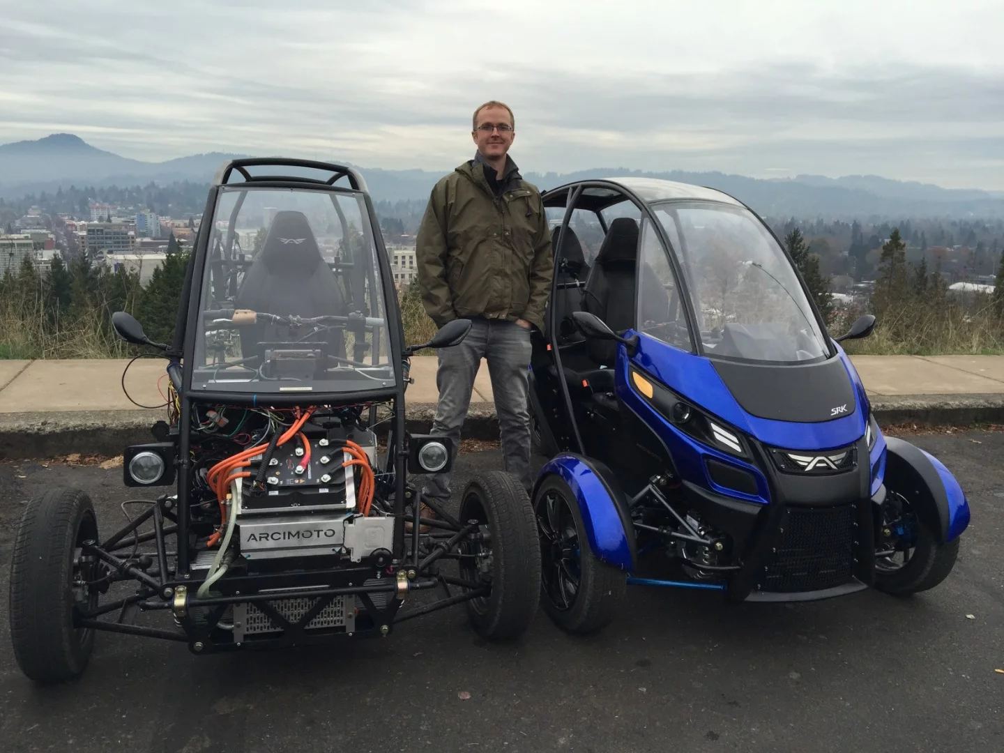 Arcimoto founder Mark Frohnmayer with two FUV prototypes