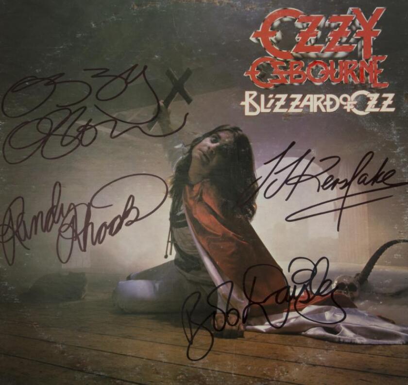 Blizzard of Oz: Lot 249 - signed by Ozzy, Randy Rhoads, Bob Daisley, and Lee Kerslake. Estimate $800 - $1,200