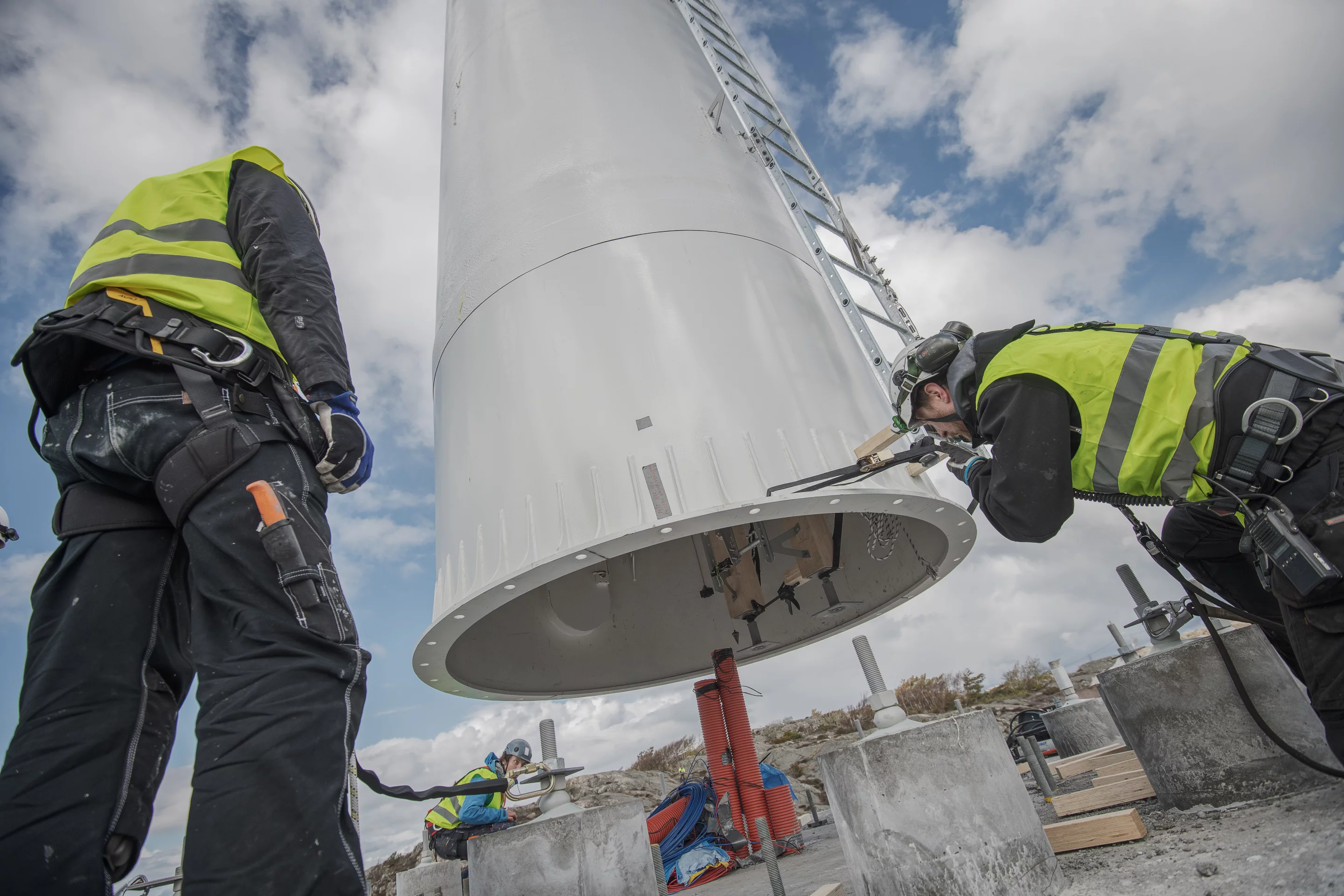 Workers install Modvion's modular wind tower in Sweden