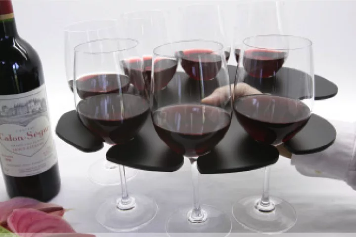 The Stem Glass Tray holds eight wine glasses in balanced formation and has a hole for your thumb