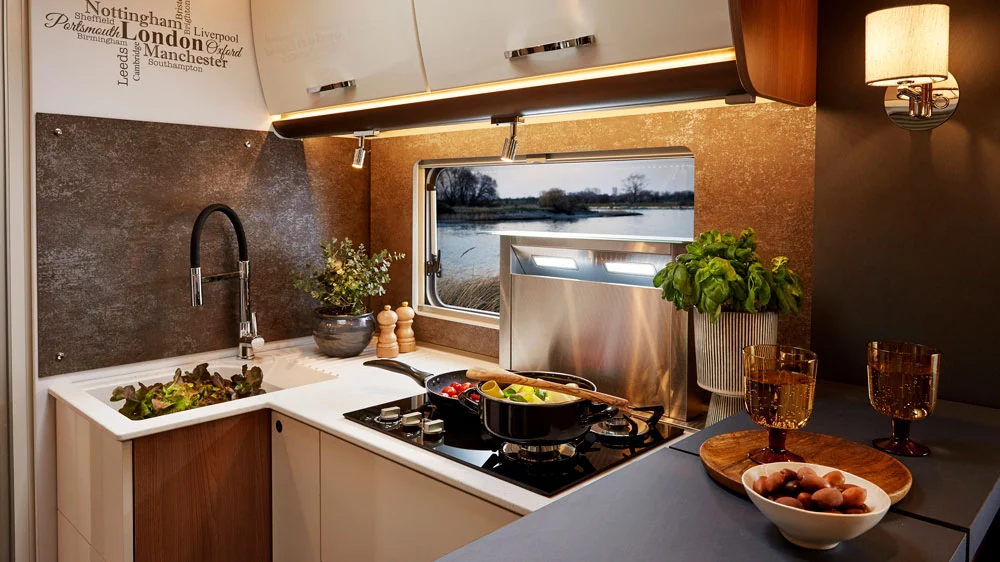 The Bürstner Lyseo Gallery concept kitchen includes a hybrid gas/induction cooktop and a sink with large, home-like faucet (2021 show vehicle pictured)