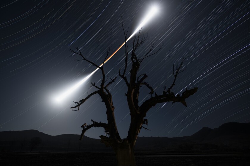Runner-Up in Skyscapes. On 31 January 2018, a spectacular total lunar eclipse occurred. The photographer set his camera for a four-hour stack exposure and after he took about one thousand images, he finally captured an image that reflects the changes of the Moon's colour and brightness before, during and after the eclipse