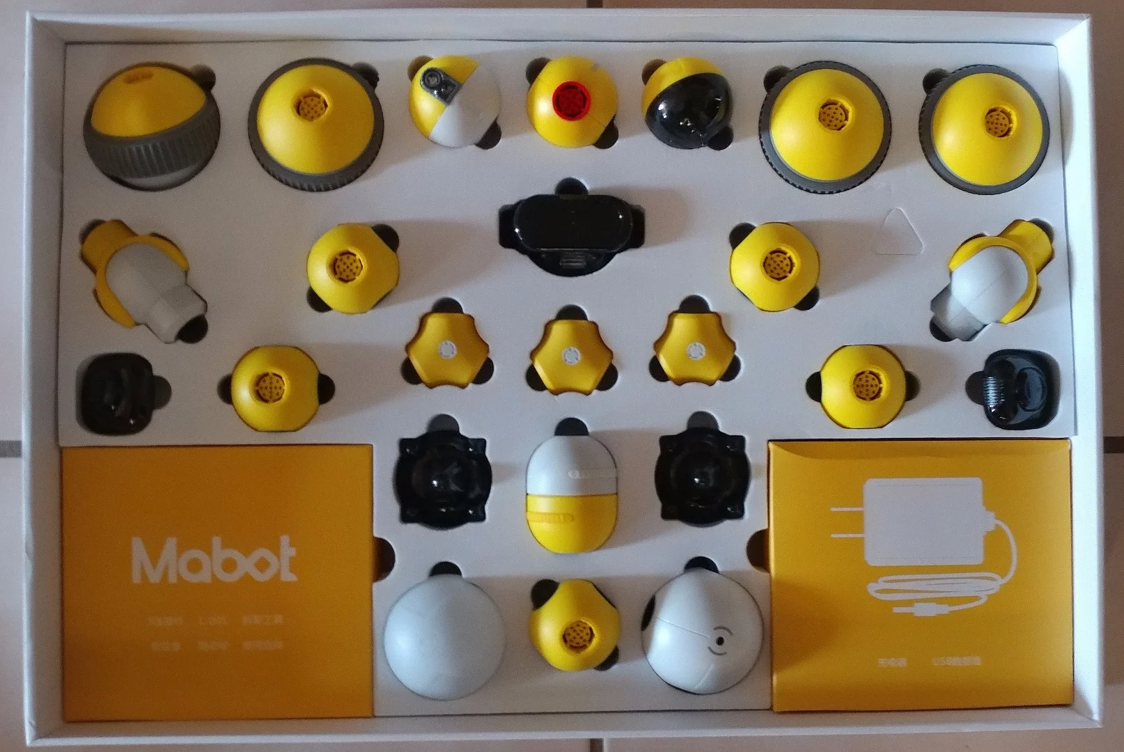 Inside our Mabot kit are a series of components set up in foam backing for security. The box to the bottom-right contains the charging cord and USB plug and the box to the bottom-left the S-rods and other connectors