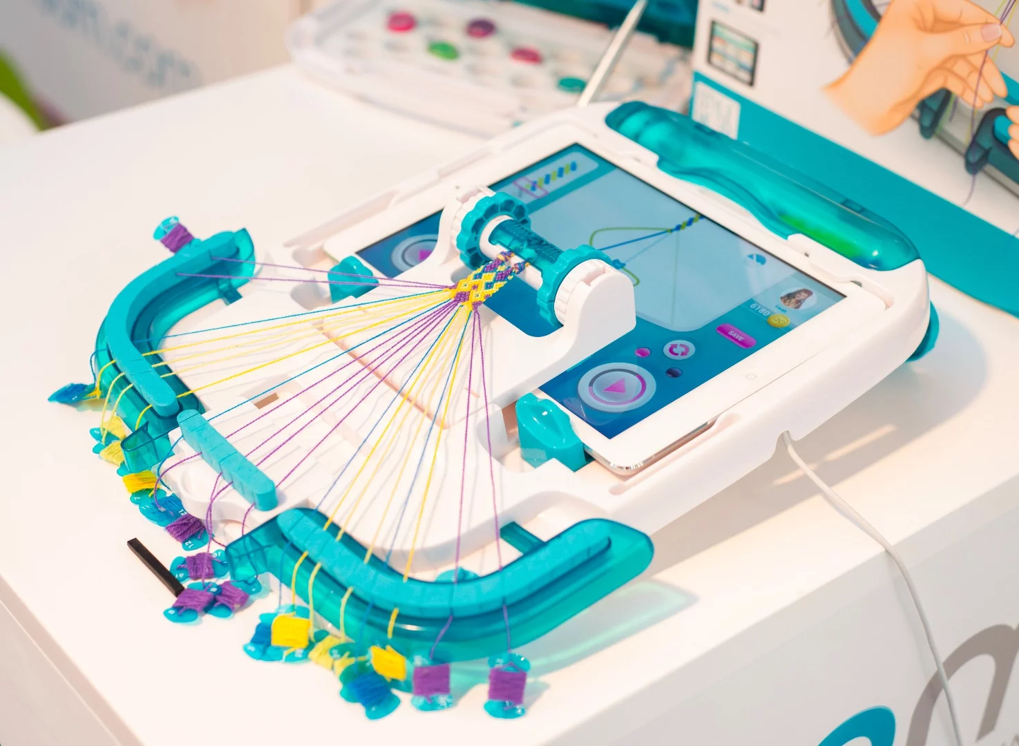 Users place an iPad running the iLoom app into the device and follow on-screen instructions