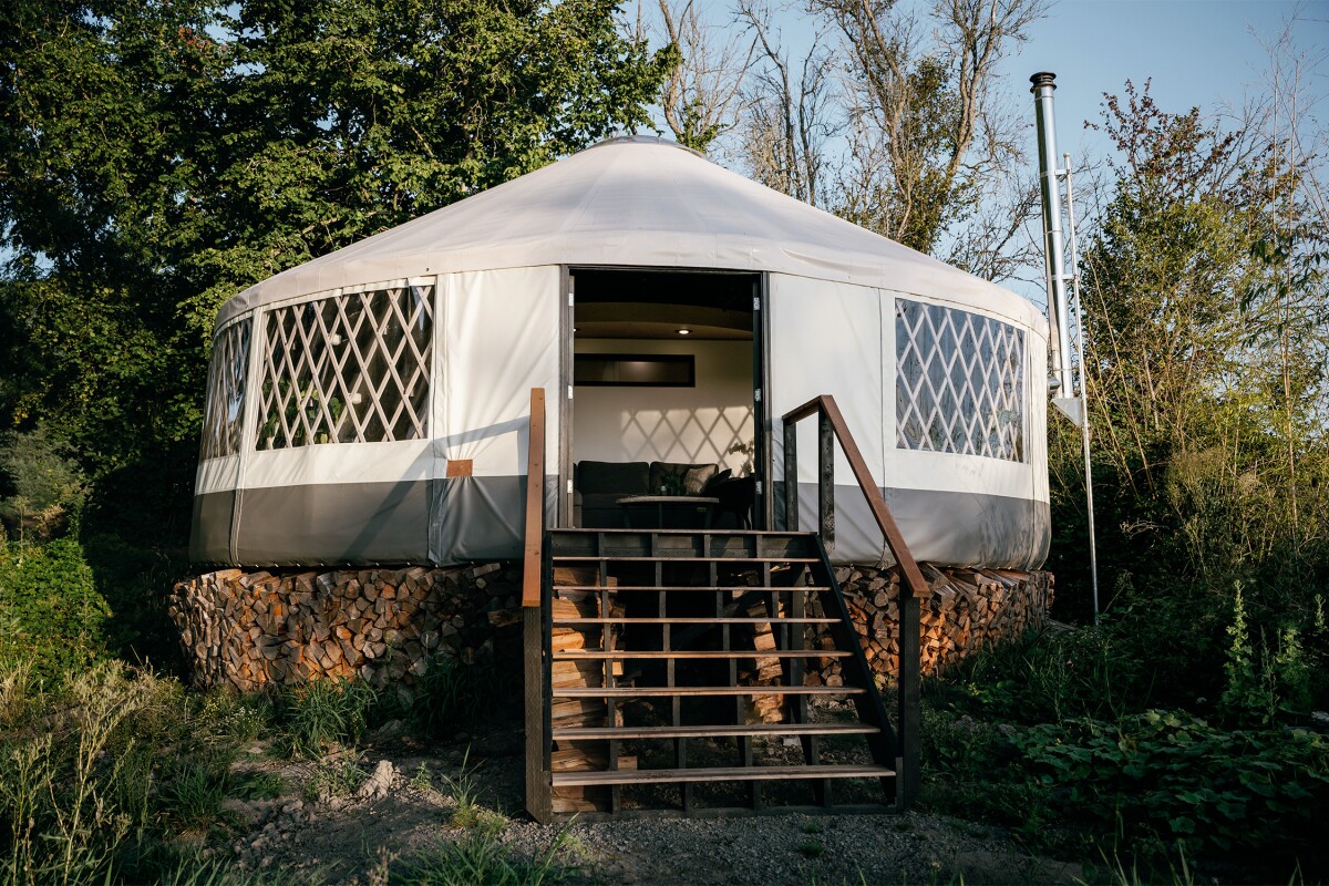 Utilizing a traditional yurt structure, the home measures just over 30 ft (9.14 m) in diameter