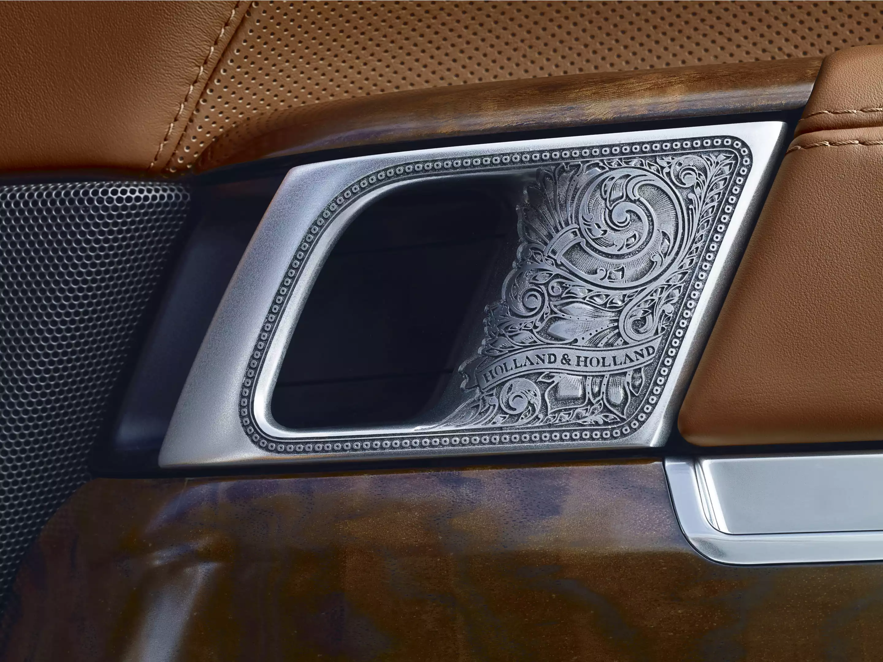 The Holland & Holland Range Rover has the gunsmith's scrollwork of the interior door handles