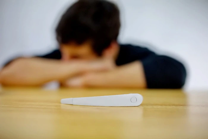 The device looks like a simplified Bluetooth headset