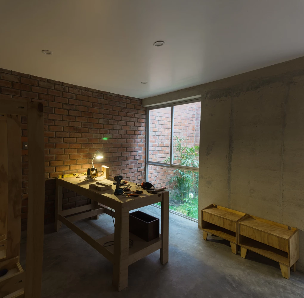 The home includes a workshop with garden view