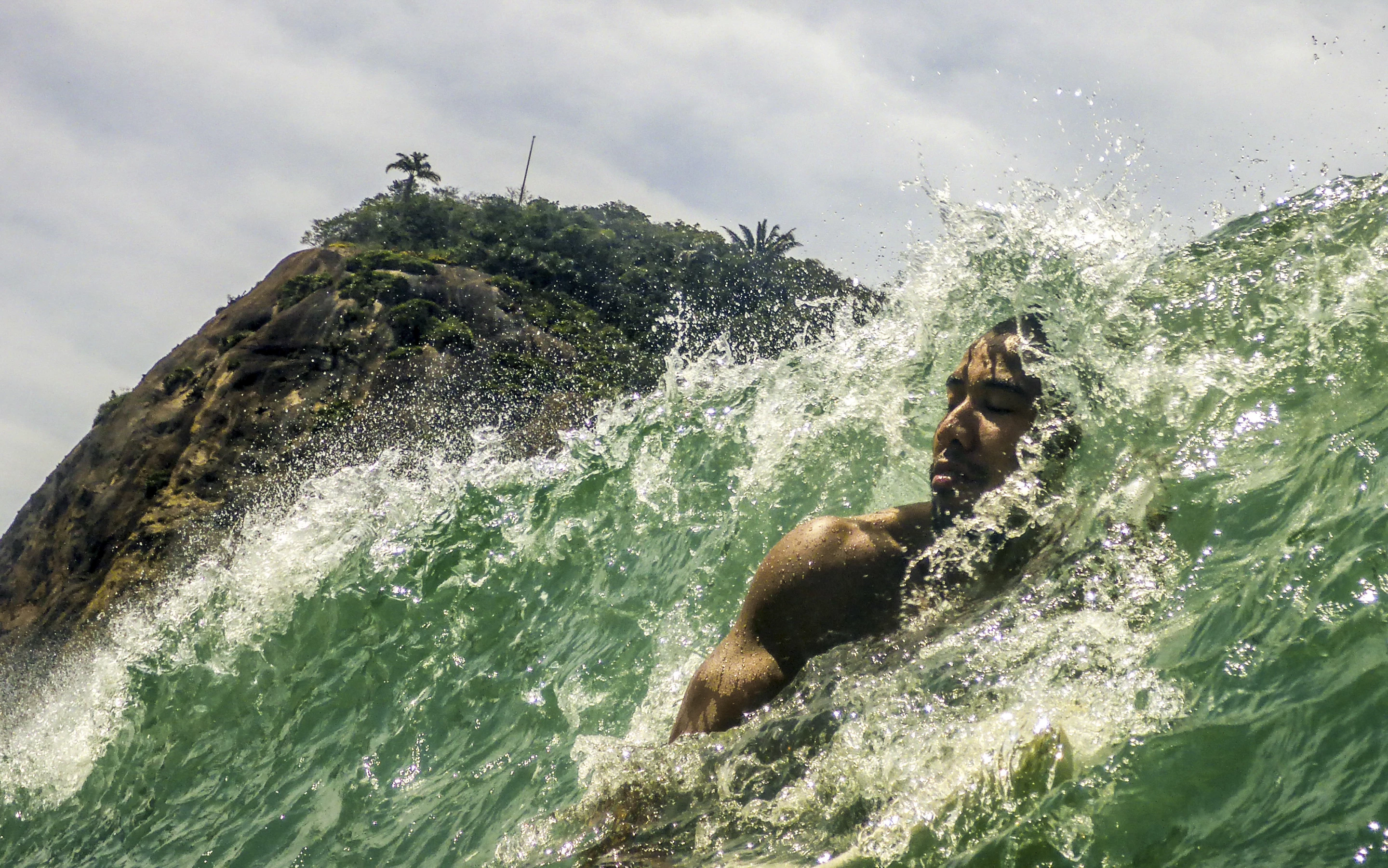 Honorable Mention, People in Nature. A surfer enjoying a good wave in Copacabana.