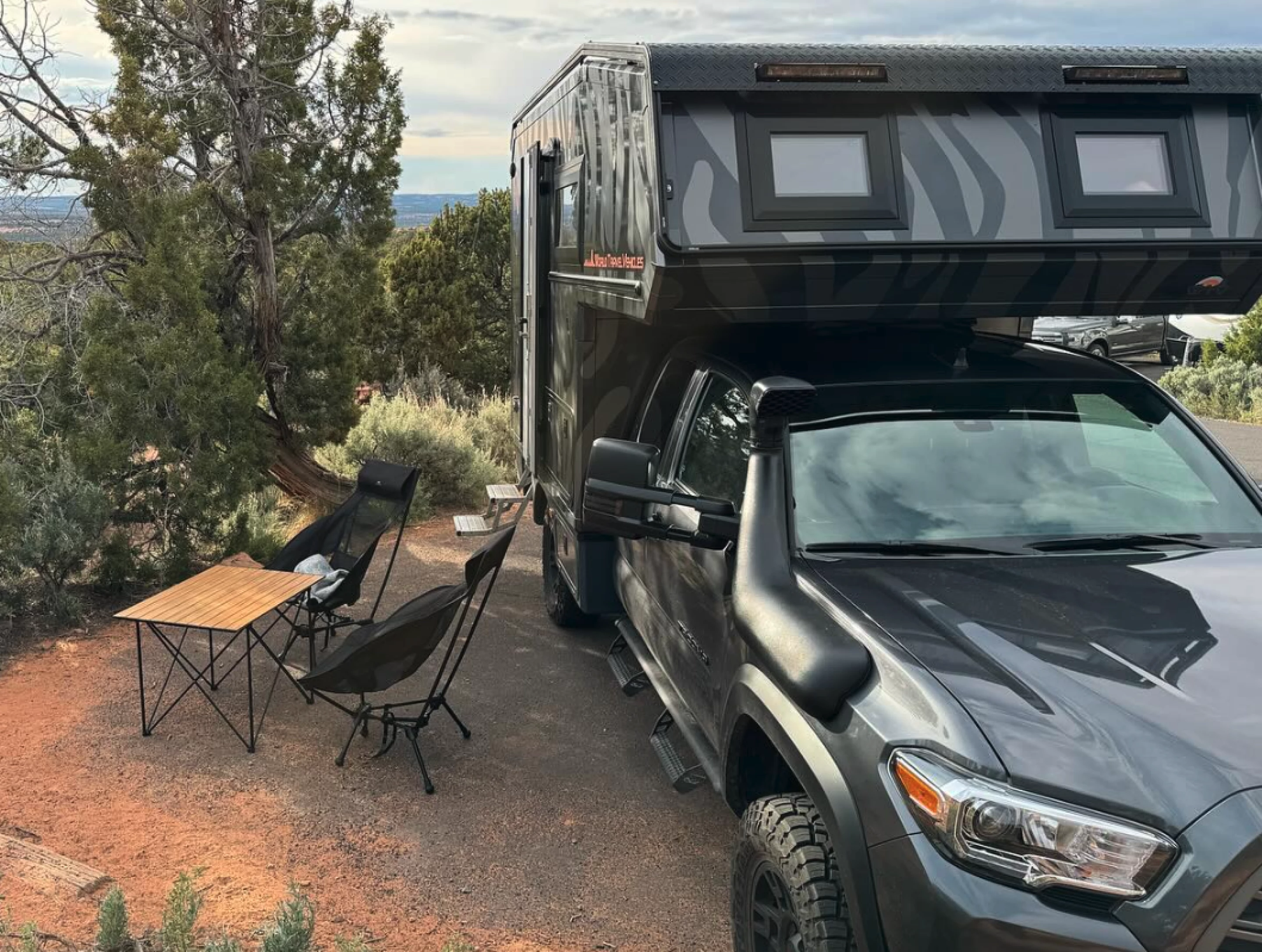 Killer Toyota micro-camper provides trapdoor access to rustic abode