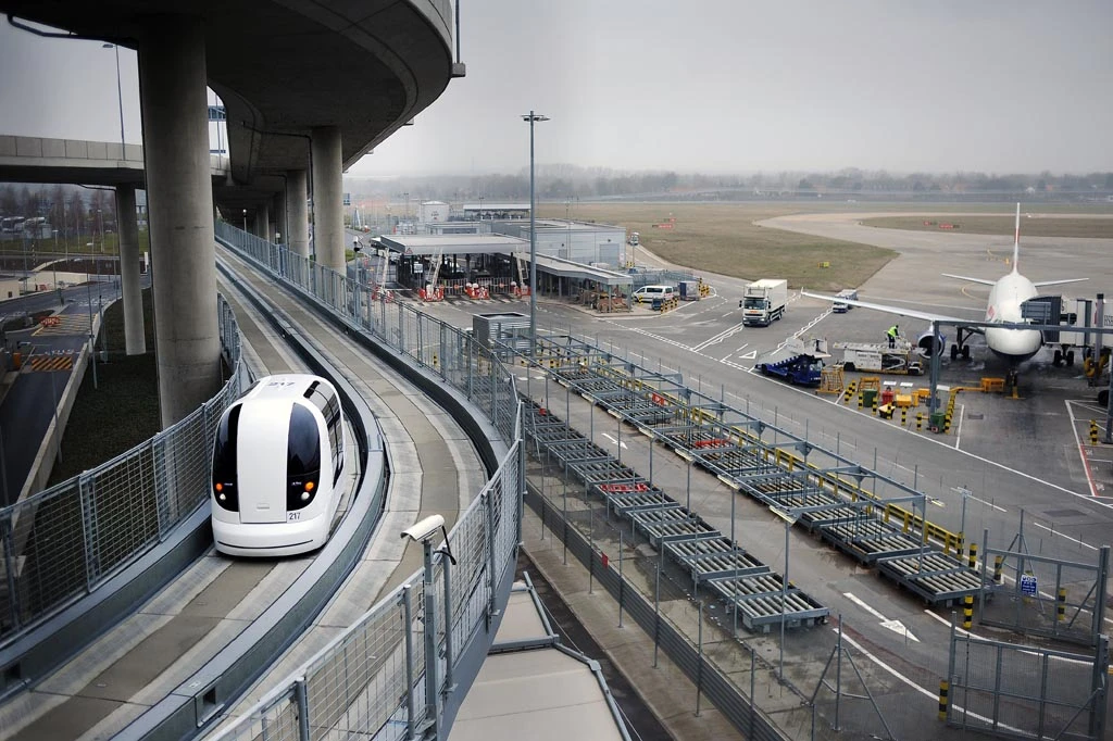 Electric point-to-point podcars connect Heathrow's Terminal 5 with two business parking lots, carrying approximately 800 passengers each weekday