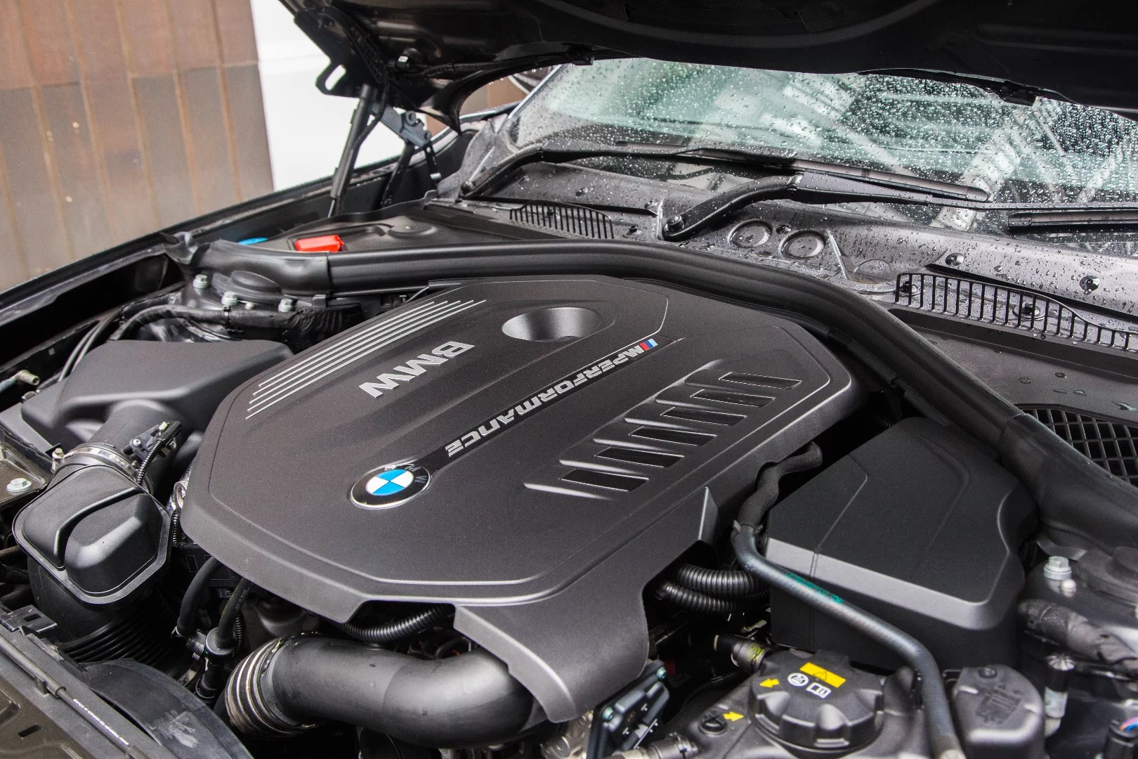 The engine in the BMW M140i Performance Edition is hidden away under a plastic shroud, but trust us – it's brilliant