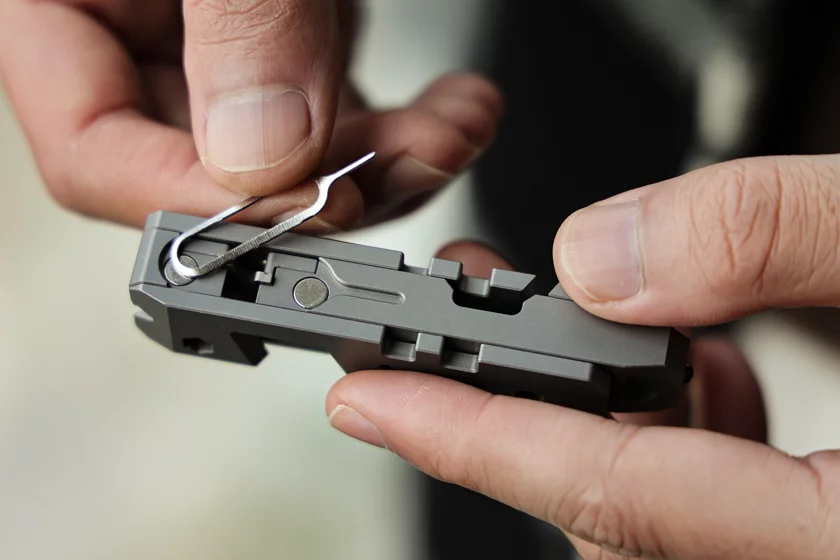 The SIM card ejector pin is held in place by magnets when not in use