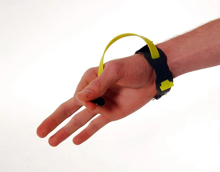 The lanyard can be positioned over the top of the picking hand or through the palm