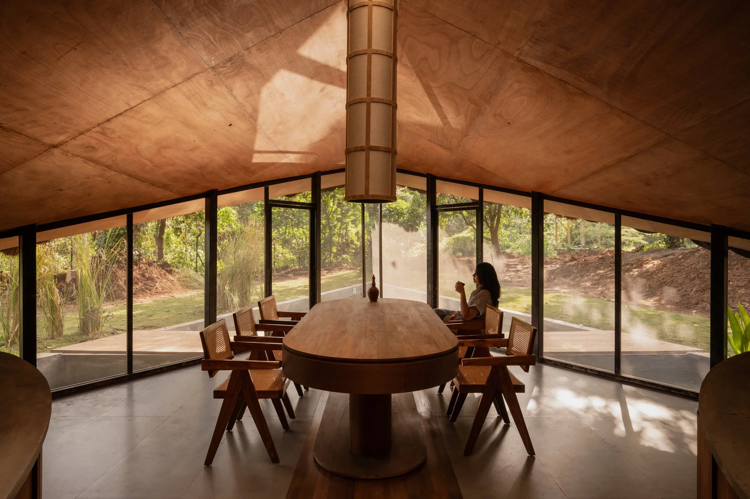 Floor to ceiling windows make the most of natural light in the dining area