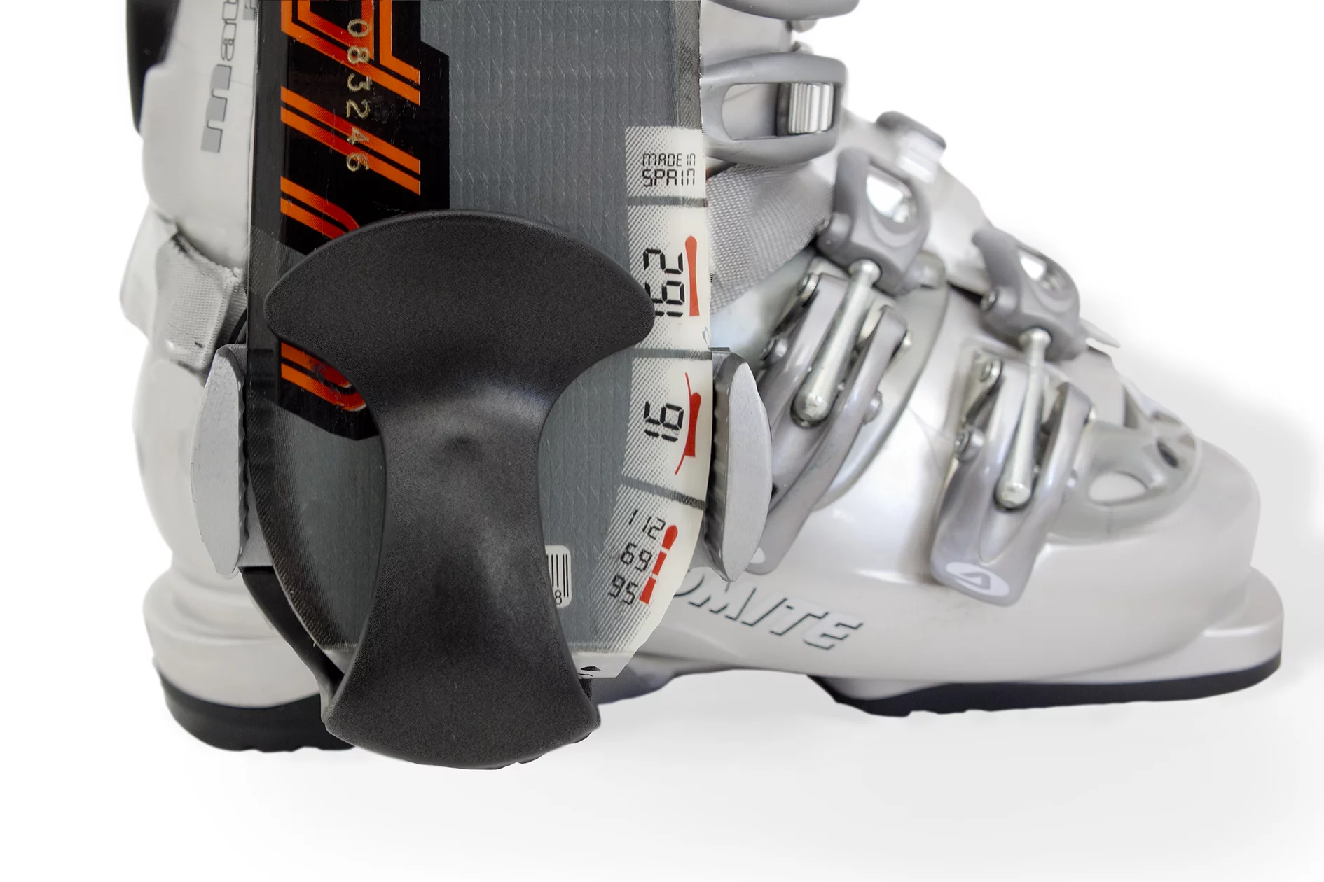 A clip cradles the bottom of the ski, while an adjustable-width guide adds some lateral stability