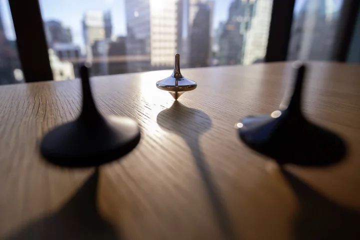 Limbo is actually a self-balancing gyro that keeps on spinning long after regular tops topple