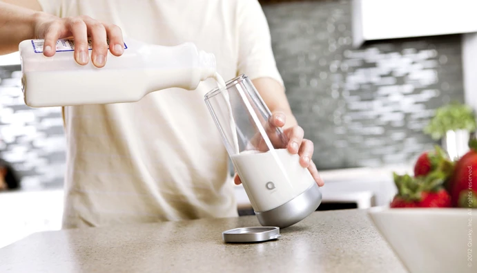 Milkmaid - A smart milk jug that detects when the milk is off and reminds you to buy more - Filling with milk