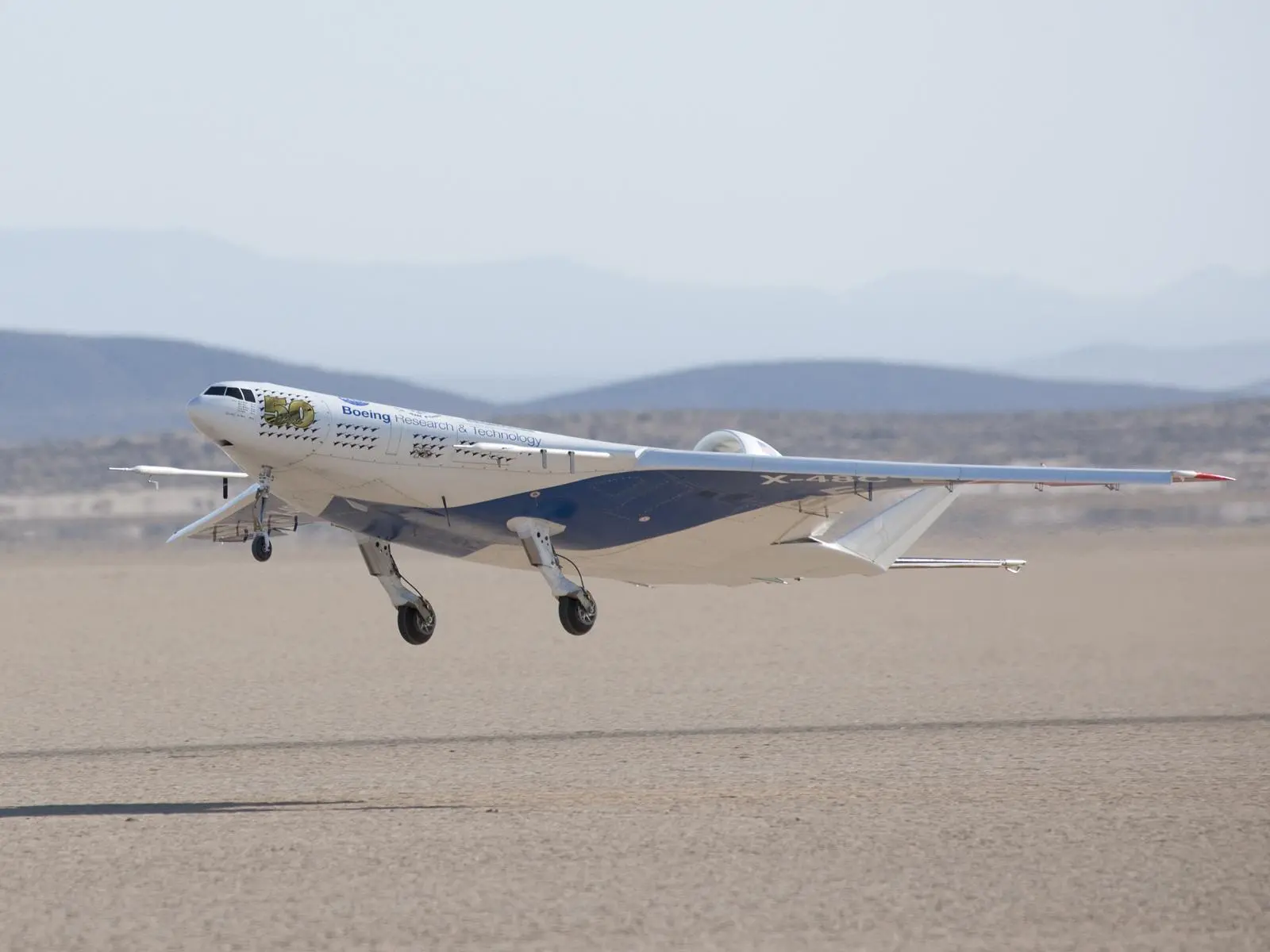 The remotely operated X-48C Blended Wing Body aircraft lifts off Rogers Dry Lake at Edwards Air Force Base, Calif., on its first test flight Aug. 7, 2012 (Photo: NASA / Carla Thomas)