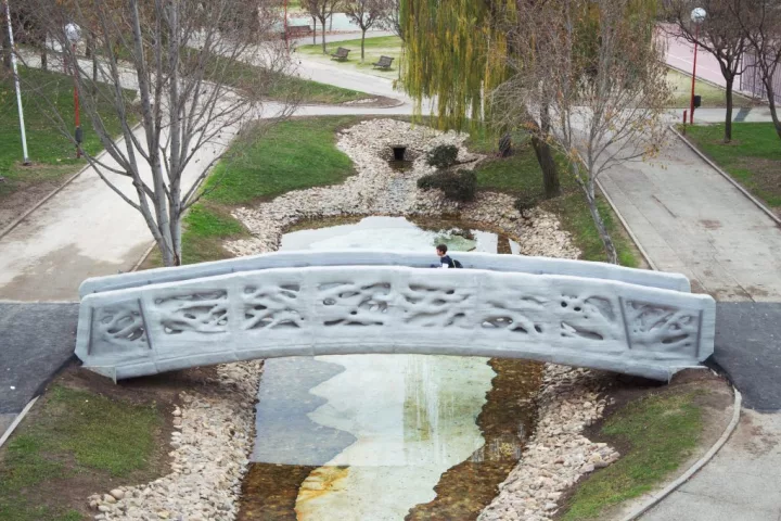 The world's first 3D-printed pedestrian bridge sits in an urban park south of Madrid