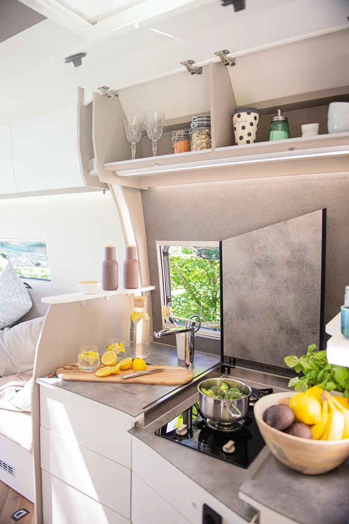 An optional package upgrades the 7.0 Lounge kitchen with the inset stove and swing-away worktop, pull-out countertop extension and more