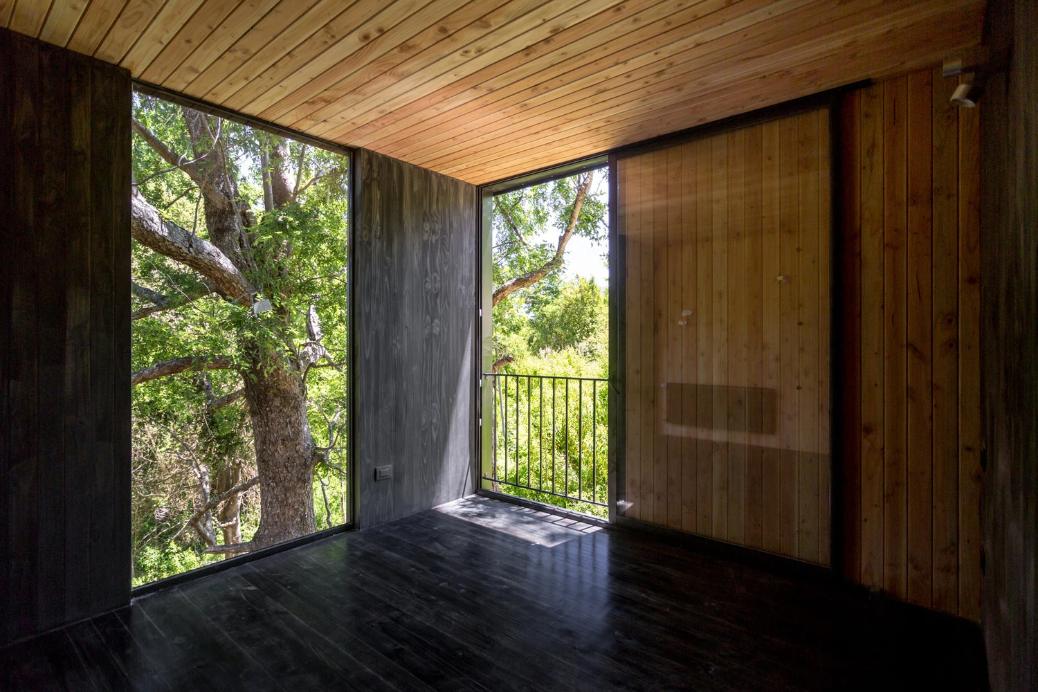 The home is elevated off the ground to give it its treehouse feel