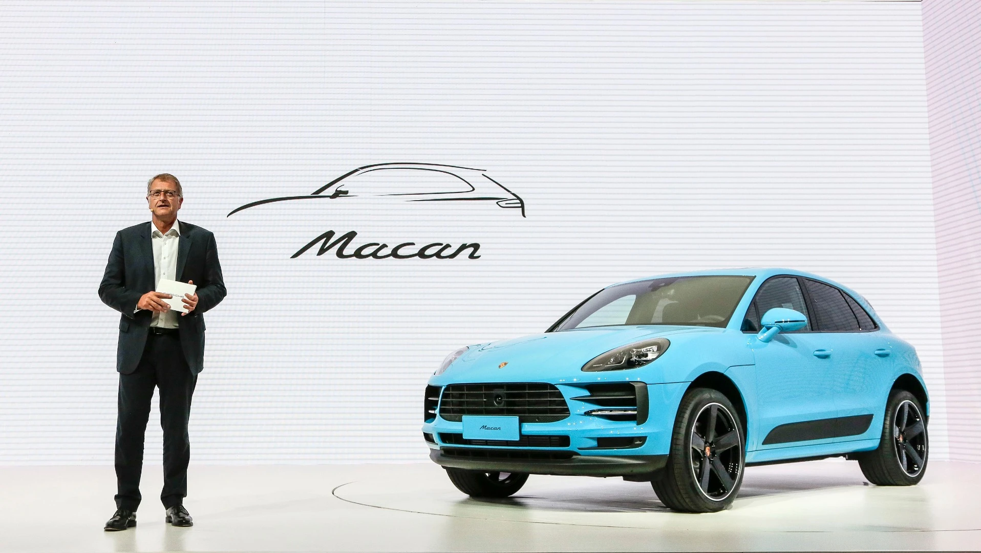 Detlev von Platen, sales and marketing executive for Porsche, introduces the new Macan in Shanghai