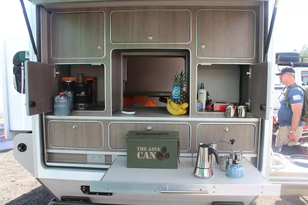 You could set up a camp stove and cooking gear under the rear lift-gate, but you could also use it as a separate prep area complementing the slide-out kitchen equipment on the side