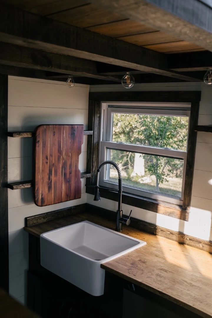 The Silhouette's farmhouse sink, with wooden chopping board cover visible