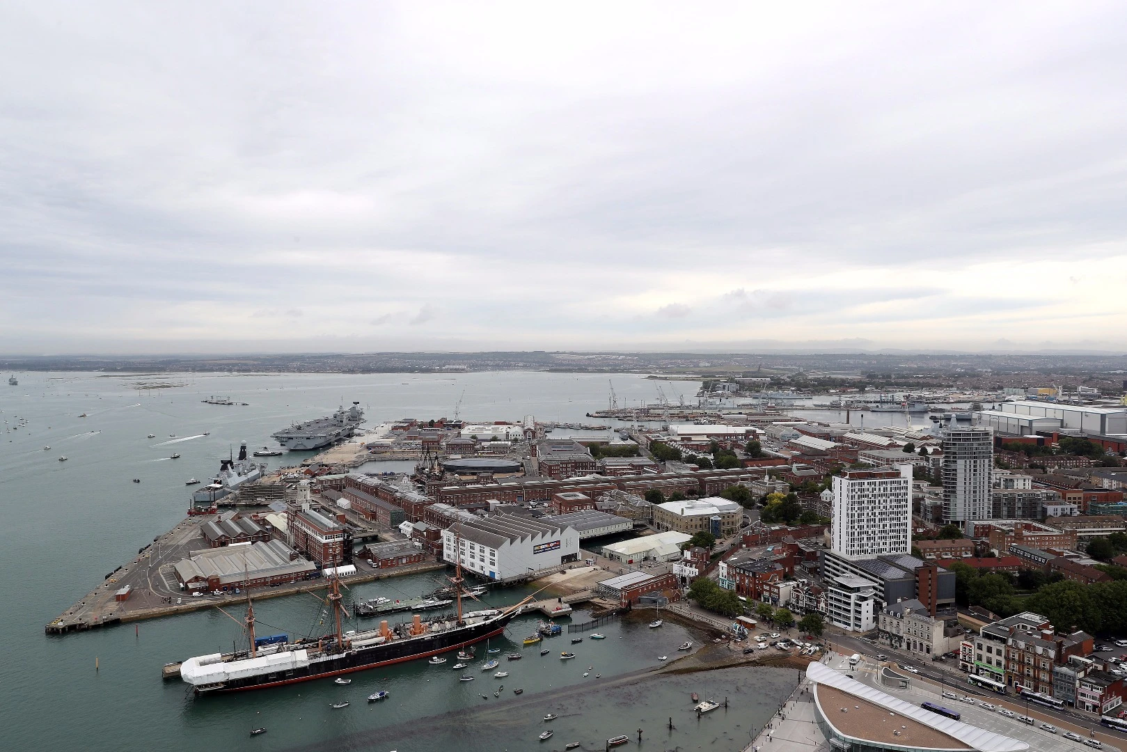 HMS Queen Elizabeth with the restored HMS Warrior in the foreground