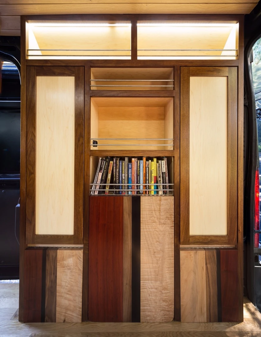 Bespoke wall features a bookcase and lots of storage