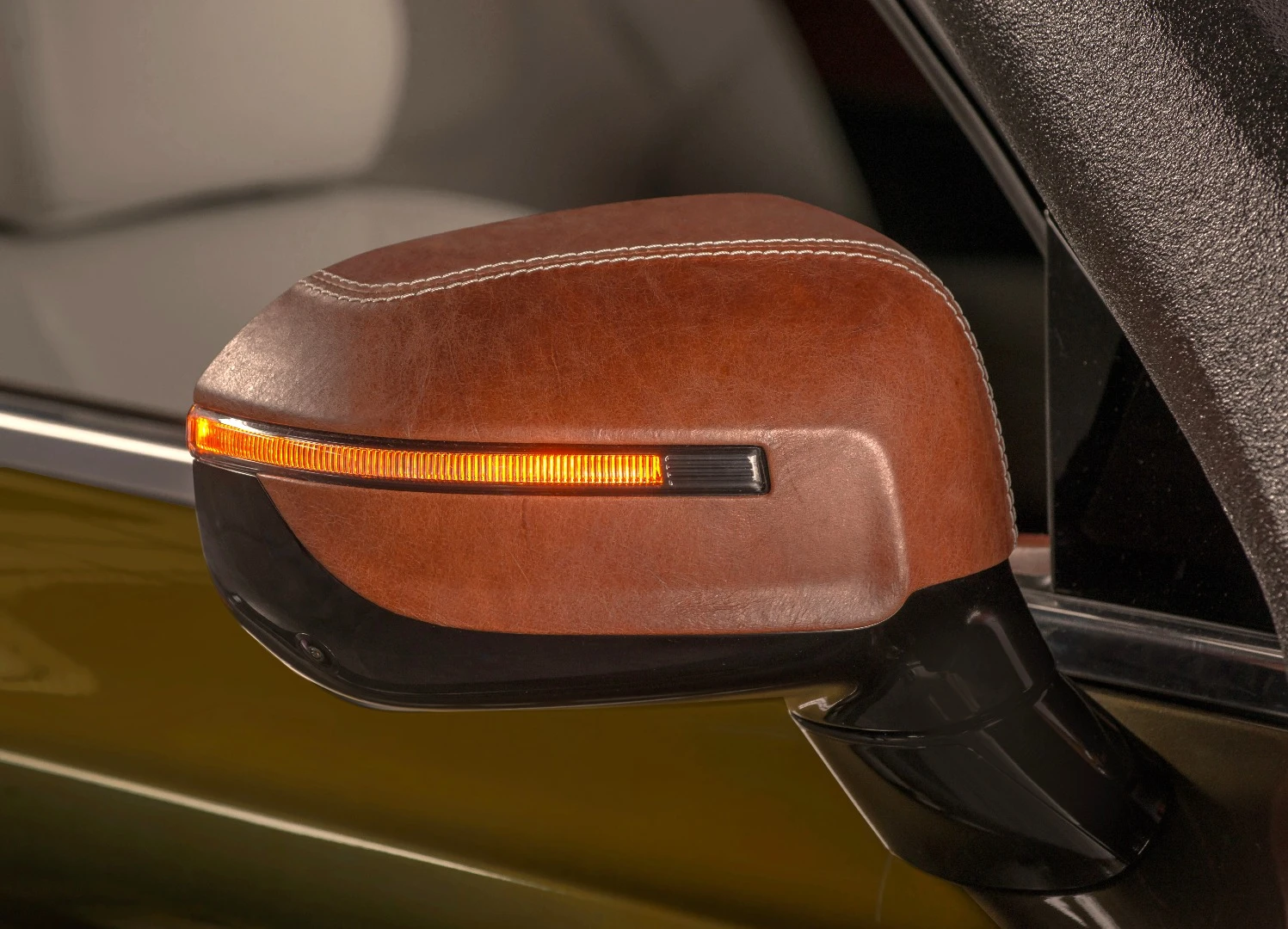 Leather inside is normal in the auto industry, but the leather mirror caps are a different touch