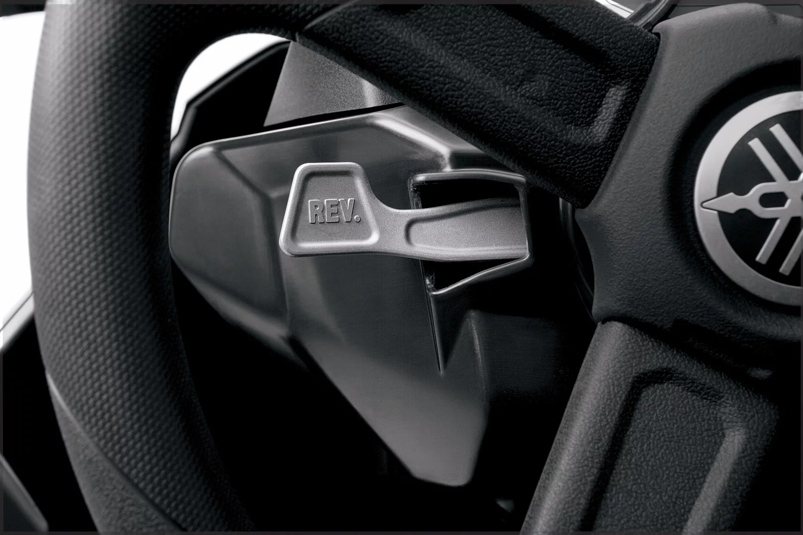 This paddle is used in conjunction with the gear shifter to make sure that reverse is not selected by mistake