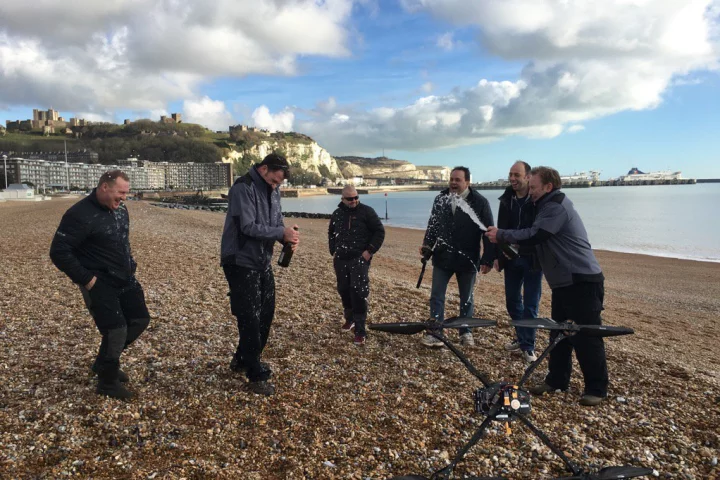 The Ocuair team celebrates after their custom drone flew across the English Channel