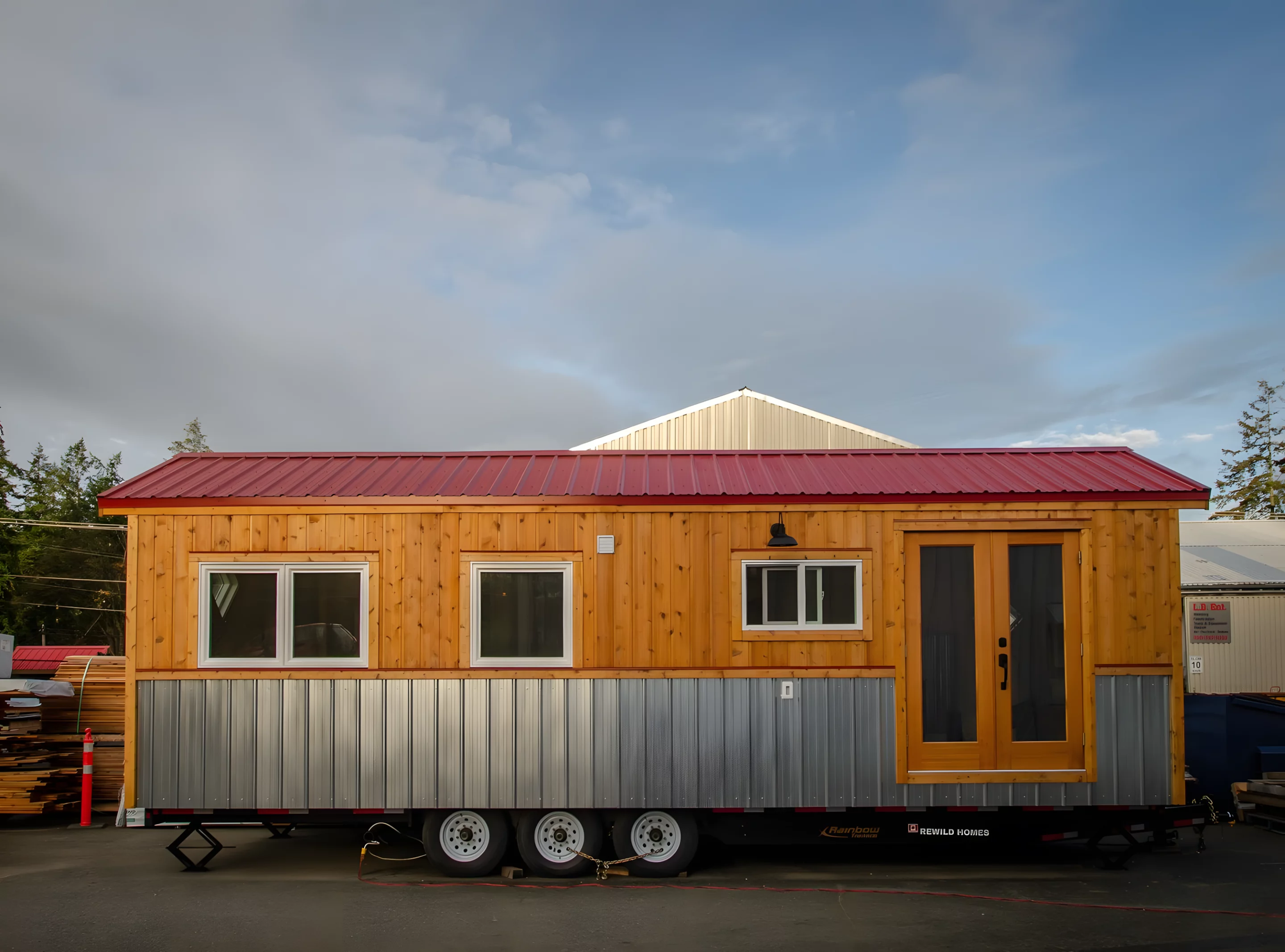 The Huckleberry is finished in wood, with metal accenting, and is topped by a metal roof