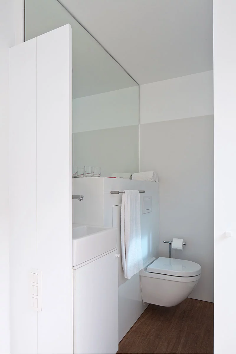 Each 20-foot long guest room has enough space for a floating box-spring bed, iPod docking station, air conditioning, and a bathroom area with a toilet and rain shower