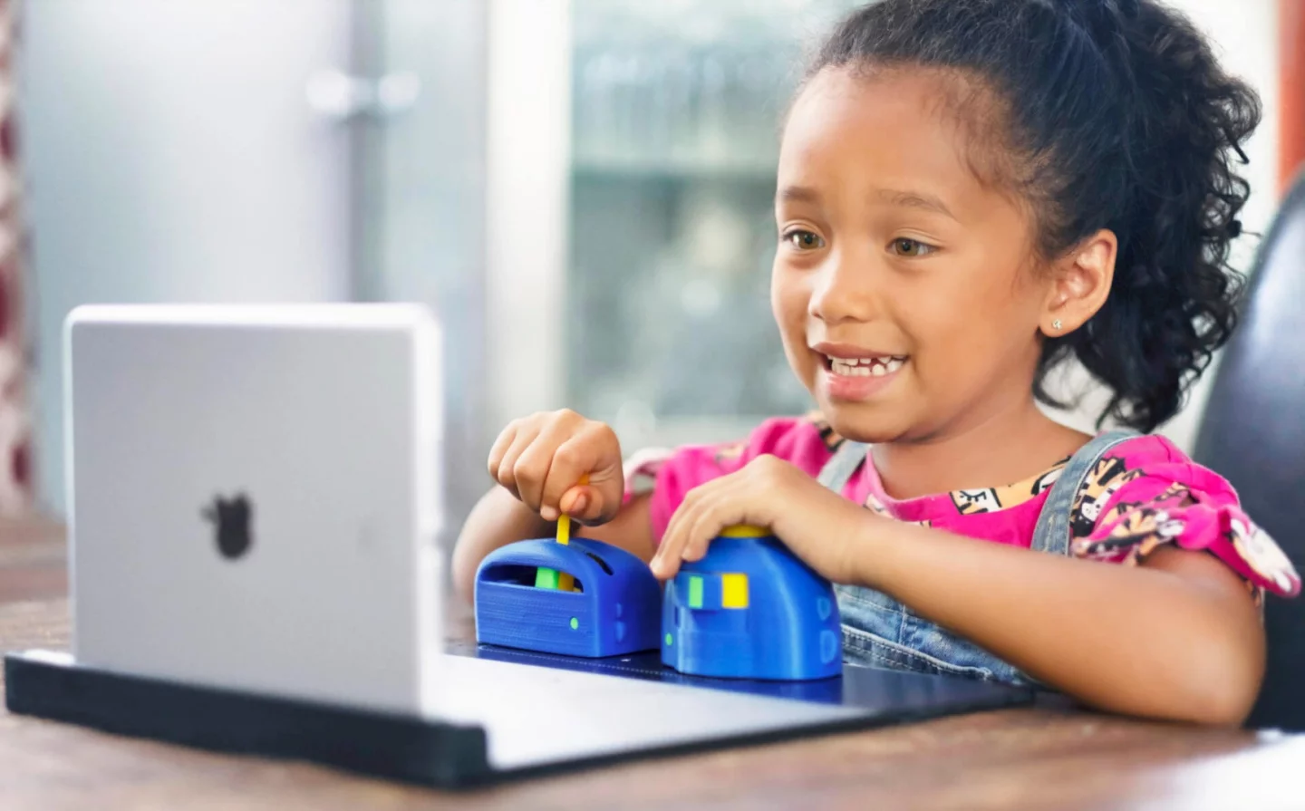 Plugo Quest includes a joystick and button, which are used to play a range of games focused on reading comprehension and vocabulary building