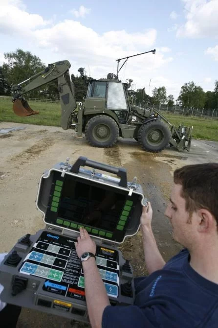QinetiQâ€™s Robotic AppliquÃ© Kits convert standard Bobcat loaders into unmanned vehicles