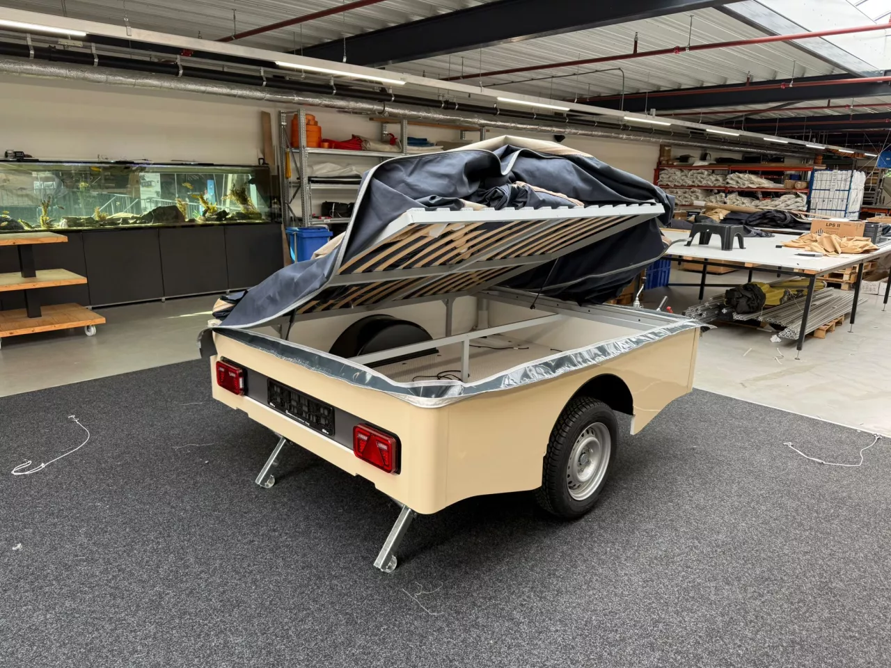 The Tow foam mattress sets up on the slatted frame above the cargo tub