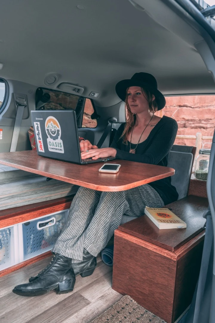 With the optional swivel table, the Oasis camper is an attractive digital nomad travel machine