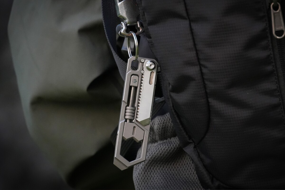 4-in-1 EDC tool packs a foldable saw in a sleek titanium frame